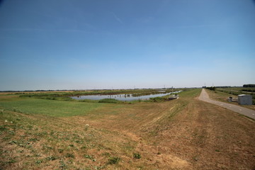 Fototapeta premium fields in the Eendragtspolder in Zevenhuizen the Netherlands, a polder used for water storage to protect Rotterdam agains flooding.