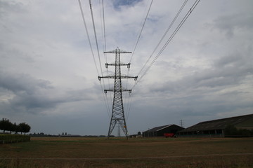 Electricy lines with towers to carry in Overijssel, The Netherlands.