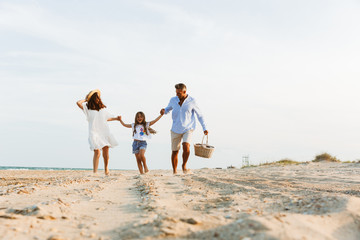 Happy family having fun together at the beach.