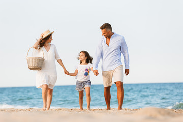 Happy family having fun together at the beach.