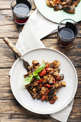 Traditional sicilan eggplant dish caponata on the wooden table, selective focus