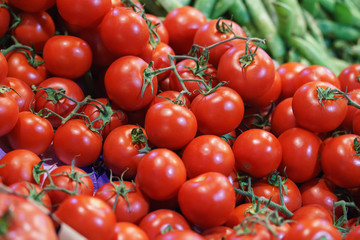 Fresh tomatoes on the counter of a street market or a supermarket or a store. 