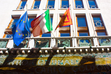 Fototapeta na wymiar Venice flag with lion, italian flag and flag of the European Union in Venice