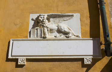 Winged venetian lion - detail of the building's facade in Venice, Italy