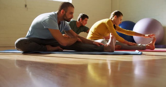 Group of people doing stretching exercises 4k