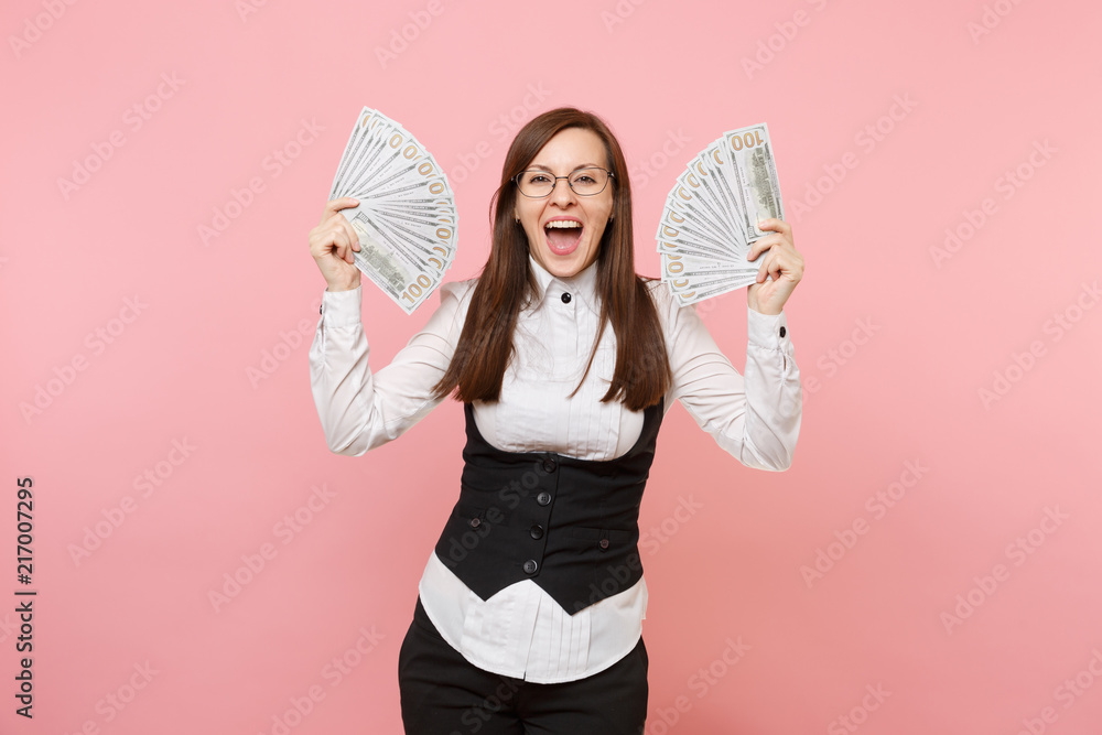 Wall mural young overjoyed business woman in glasses holding bundle lots of dollars, cash money spreading hands