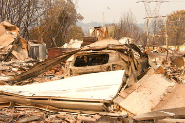 home burned to the ground, garage door buckled and laying in a heap after the recent wild fire fire...