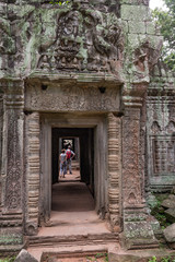 Fototapeta na wymiar Exploring Ta Prohm temple in the Siem Reap area of Cambodia
