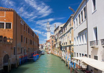 Fototapeta na wymiar Beautiful romantic Venetian cityscape with canal in Italy