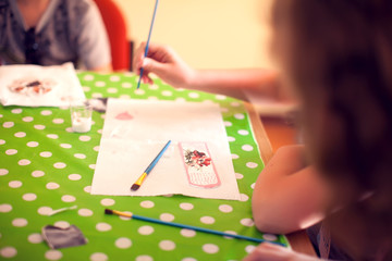 Fototapeta premium Children hands making artworks with wood and paint crafts. workplace and handcraft