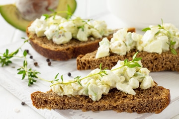 Avocado sandwiches close-up. Traditional latinamerican mexican sauce guacamole. Healthy fat, omega 3.