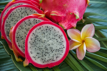 Slices of Fresh Raw Exotic Tropical Thai Dragon Fruit also called Pitayas on Banana Leaf