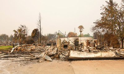 home burned to the ground, garage door buckled and laying in a heap after the recent wild fire fire...