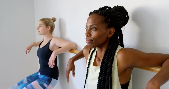 Group of women exercising on the barre 4k
