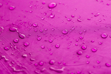 water dripped on pink umbrella