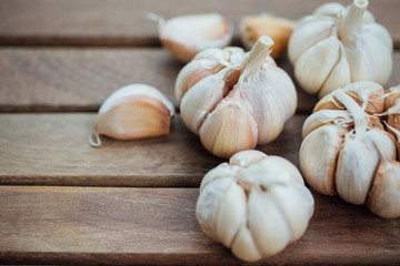 Garlic and cloves upper right corner on wooden background2