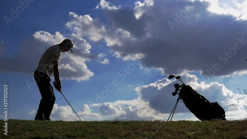 Golf Swing In Slow Motion With A Beautiful Blue Cloudy Sky