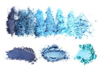 Crushed makeup products on white background. Color set of eye shadows