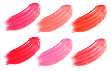 Makeup product smears on white background. Color set of lip glosses