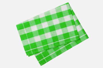 Green and white checkered napkin isolated on white background.