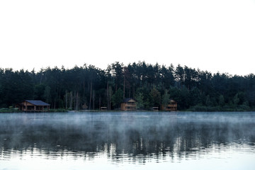 Fototapeta na wymiar Beautiful landscape with forest and houses near lake. Camping season