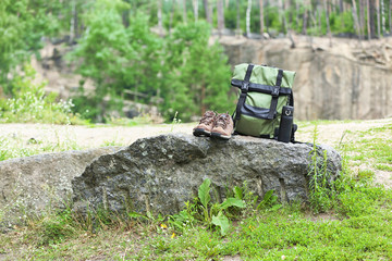 Set of camping equipment on rock outdoors