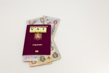 Dubai, UAE, tourist vat tax refund concept. Dirham banknotes inside a passport with the word VAT on...