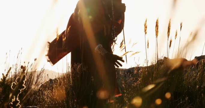 Tribal man walking in countryside 4k