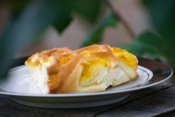 Delicious cake with apricot jam on a plate. Crostata with marmalade or peach jam filling. Homemadepie dessert with dandelion jam.