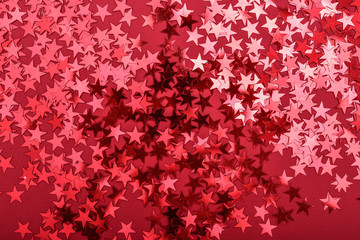 Star sprinkles on red.