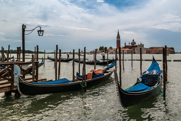 Fototapeta na wymiar Rainy day on a gondola pier in Venice Italy