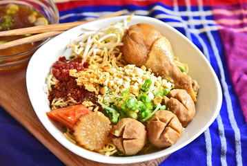 dried noodle with chicken and pork ball street food in Thailand.