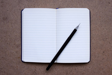 Notepad with line and pen. Back to school, paper for notes, office stationery.