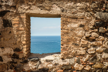 Fototapeta premium Window on old castle wall