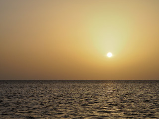 Orange hazy sunset over the sea