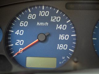 The speedometer of an automobile at zero kilometers per hour