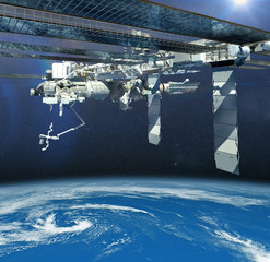 The International Space Station flying above Earth. © 3000ad