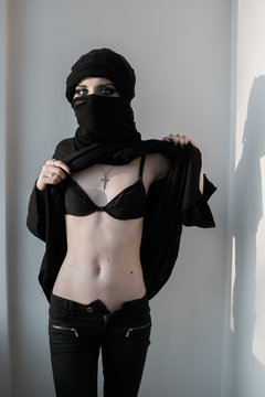 woman in paranza and cross exposing bra