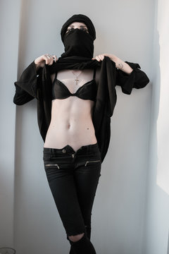 woman in paranza and cross exposing bra