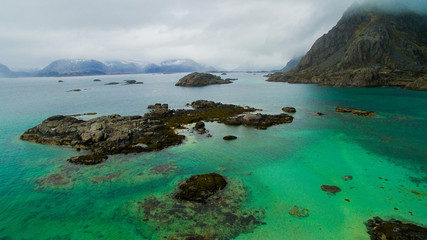 turquoise water, mountains and clouds, beautiful landscape in Norway's Lofoten