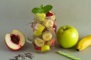 Detox water  with chia and  fruit on the grey  background