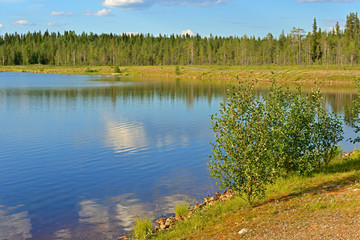 Fototapeta na wymiar White cloud in water. Northern landscape. Finnish Lapland