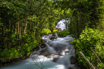 Obraz premium Geiranger - July 30, 2018: Little river stream in camping site in Geiranger, Norway