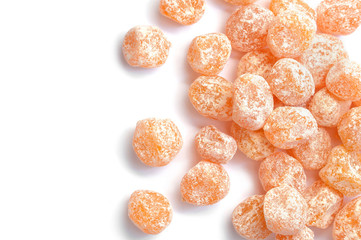 Dried sweet kumquat under powdered sugar isolated on white background.