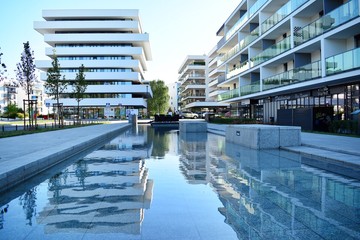 Modern apartment buildings on a sunny day with a blue sky. Facade of a modern apartment building