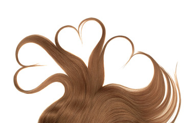 Brown hair in shape of heart isolated on a white background