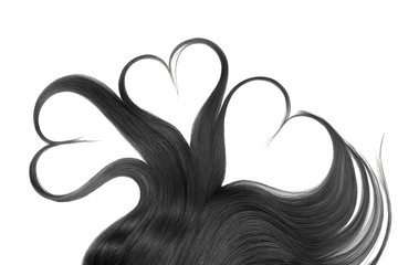 Black hair in shape of heart isolated on a white background