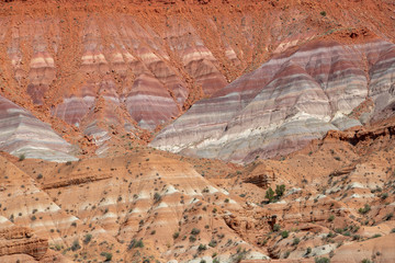 Colorful strata in the cliffs of Grand Staircase-Escalante National Monument in Paria, Utah of red, purple, gray, green, and blue in Grand Staircase-Escalante National Monument in Paria, Utah