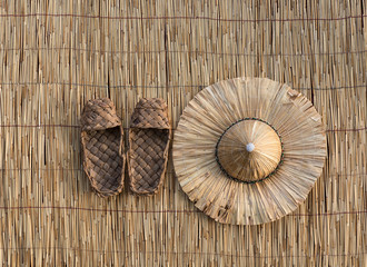 Asian straw hat on bamboo background