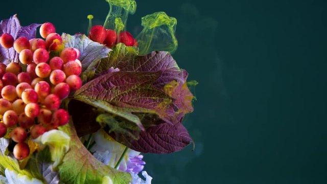 Amazing spreading of paint on beautiful autumn bouquet.